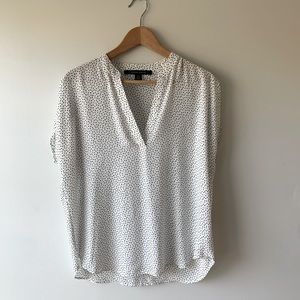Size medium white with black polka dots, short sleeve blouse
